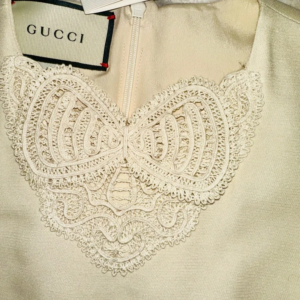 Gucci Red, Crème and Black Asymmetrical Dress with Gucci ivory dress cover. - Picture 9 of 15